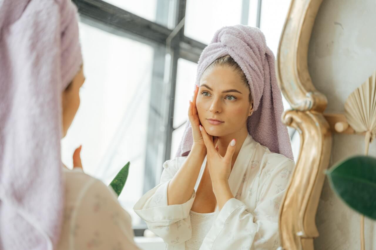 Woman looking in mirror