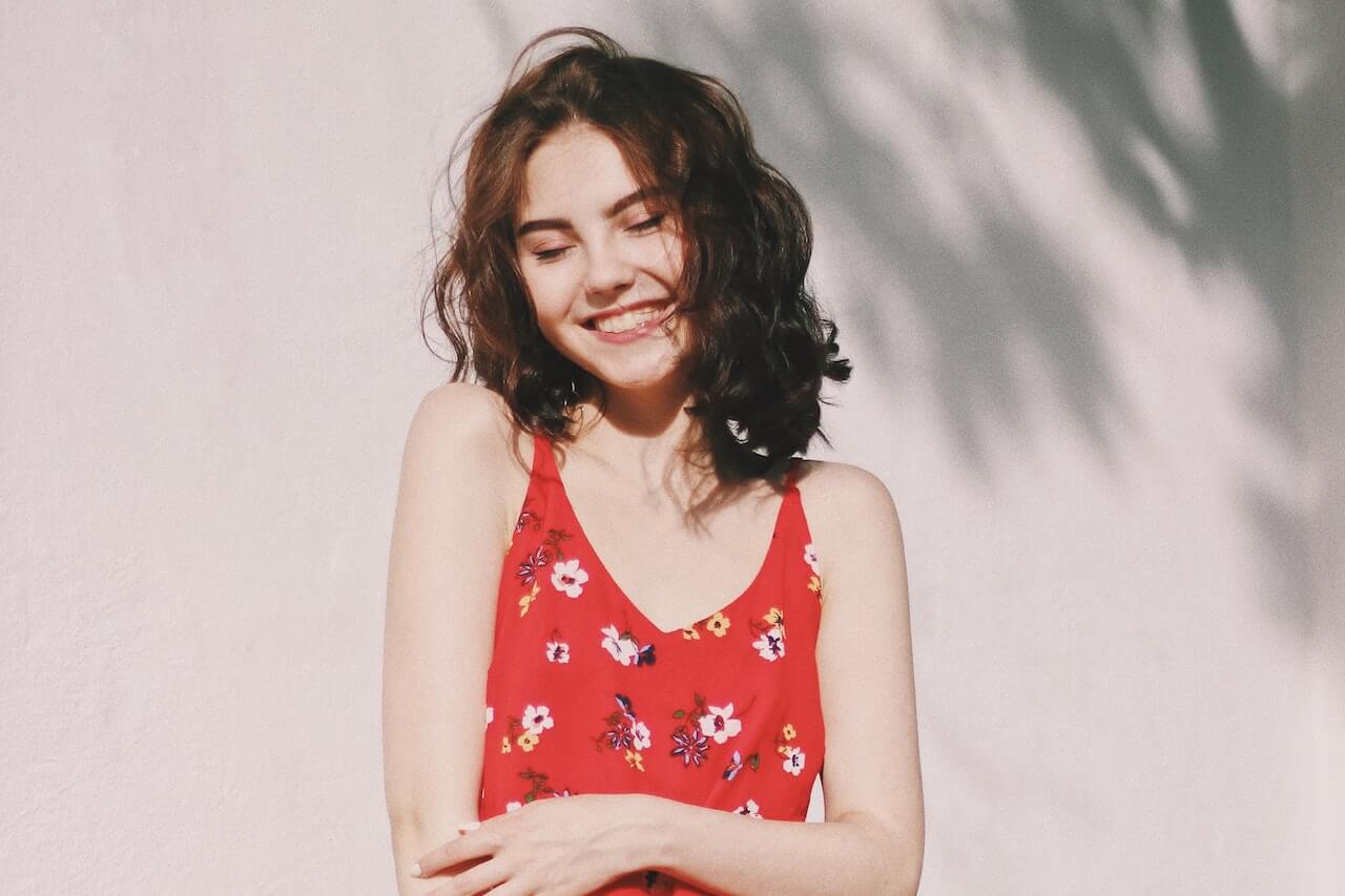 Woman with brown hair smiling