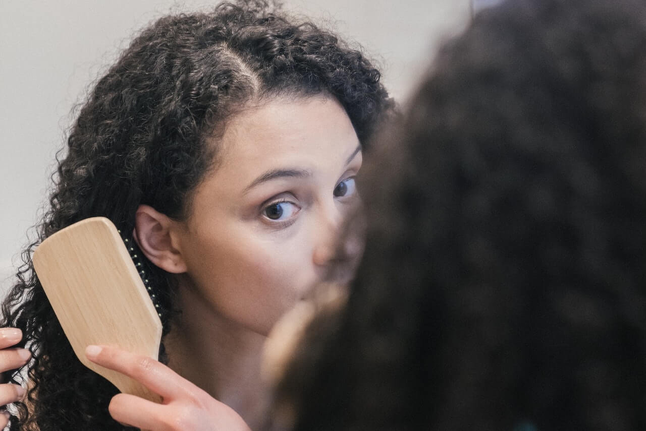 Woman brushing hair