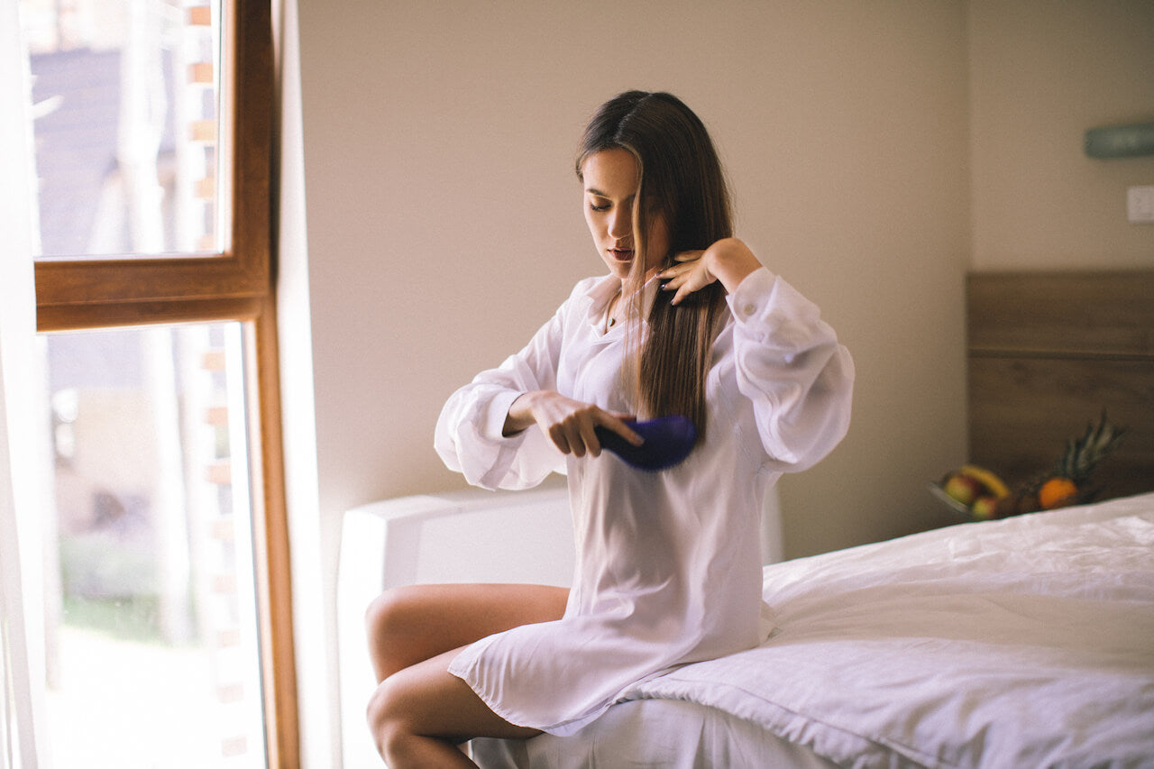 woman brushing hair