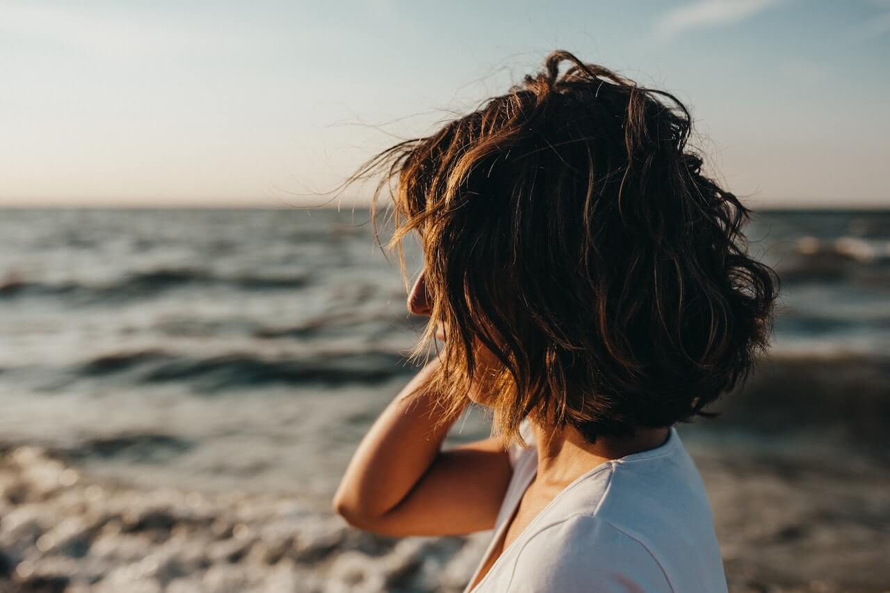 Woman looking at the ocean