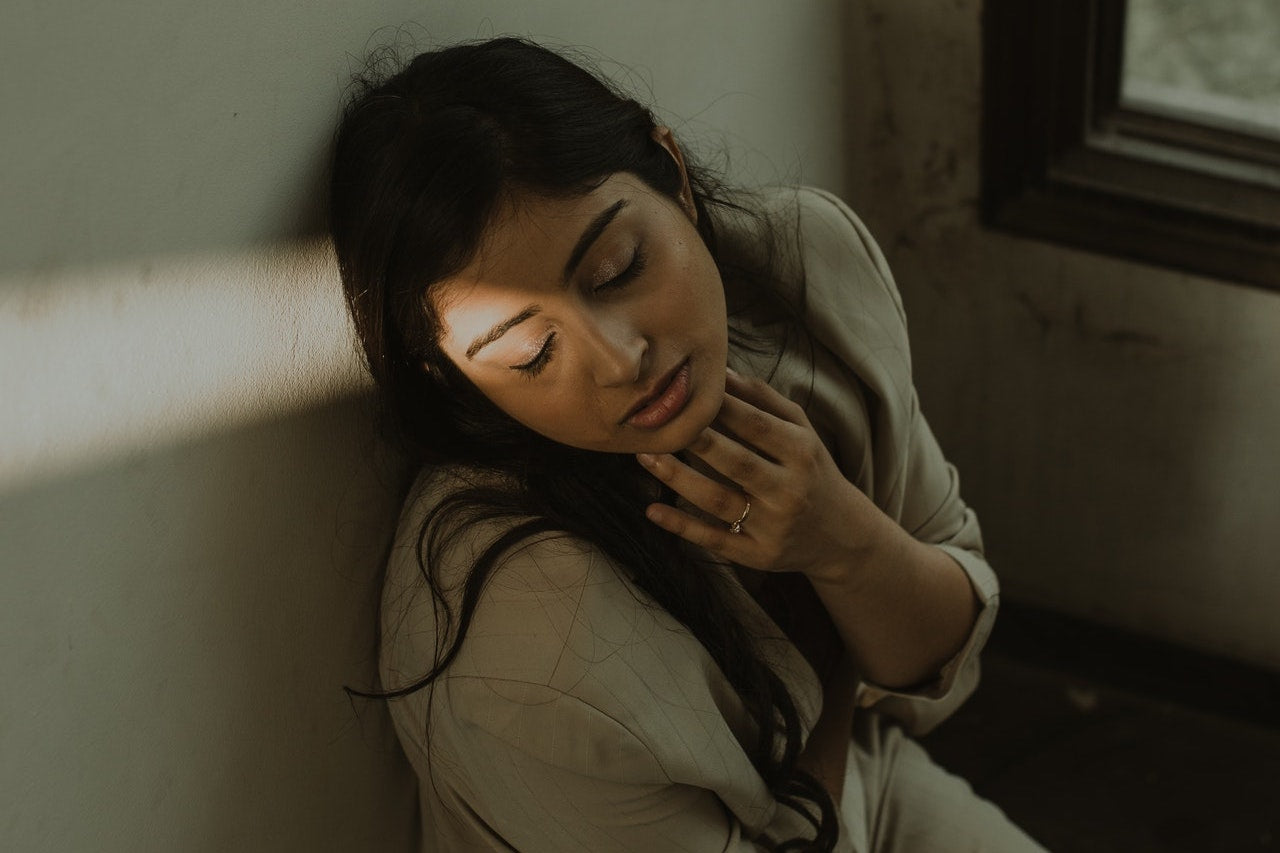 Woman with eyes closed