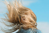 Blonde woman with hair in the windg