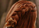 Woman with red hair in a braid