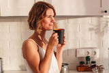 Woman in her 30s drinking coffee