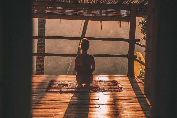 woman meditation at sunset