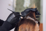 Woman getting hair dyed at salon