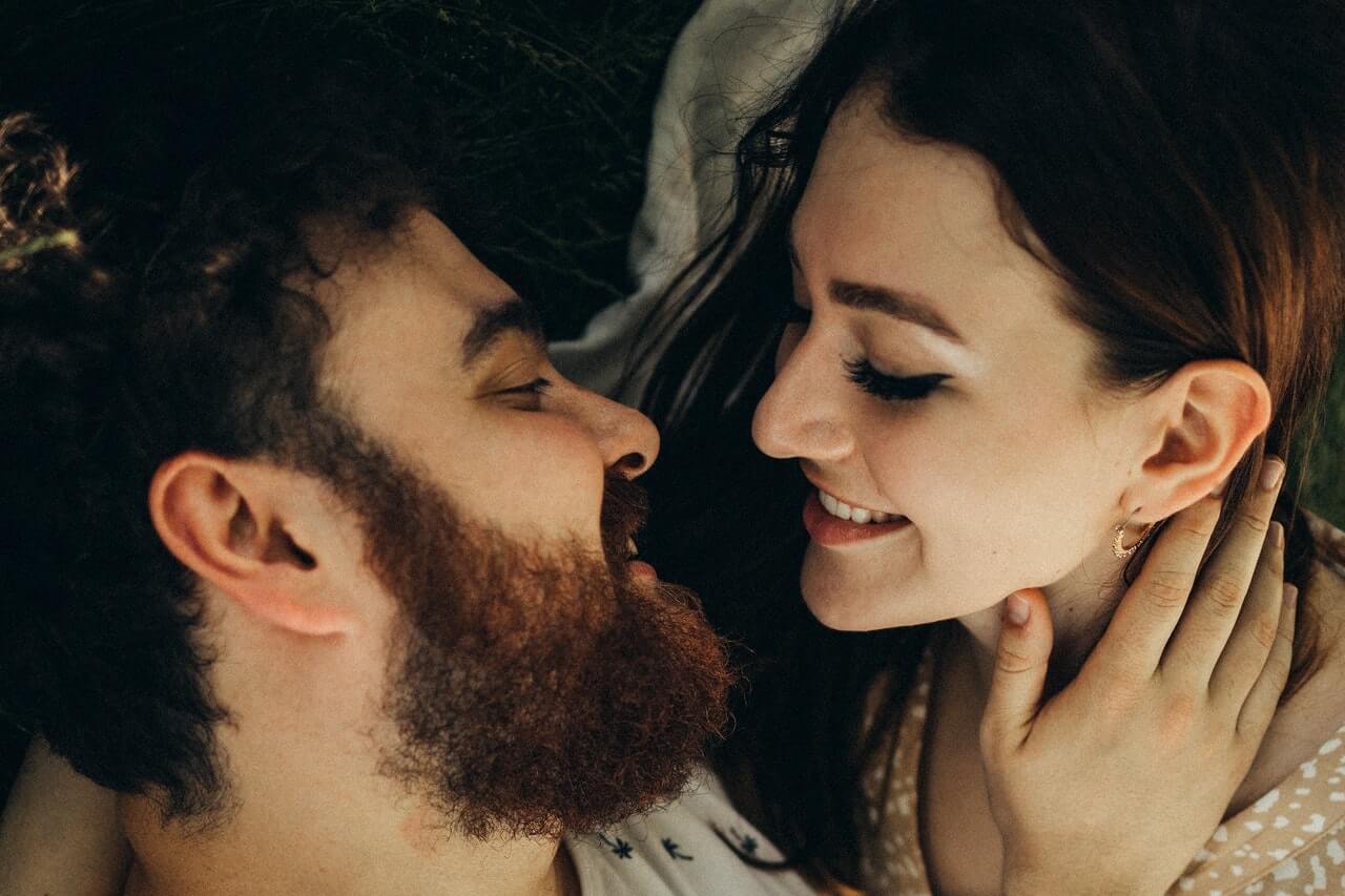 Man and woman about to kiss