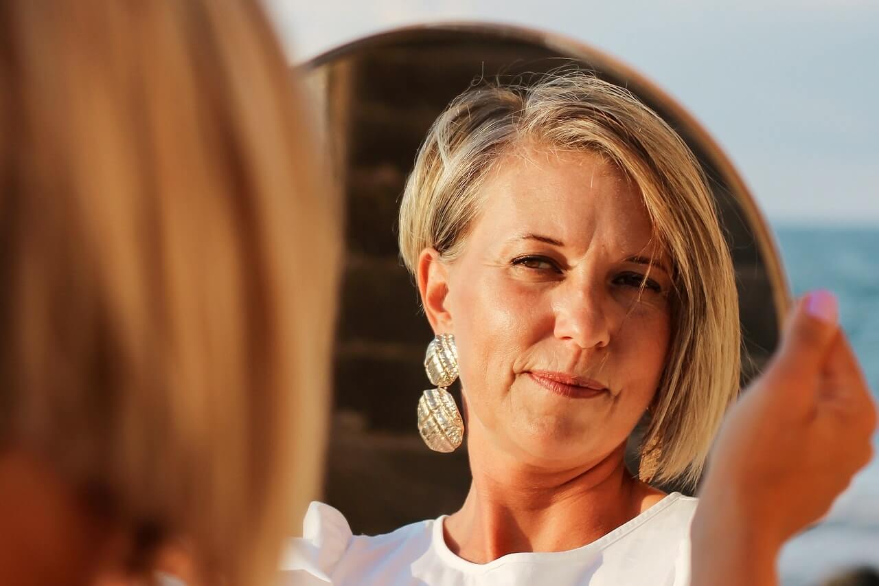 Woman looking in the mirror