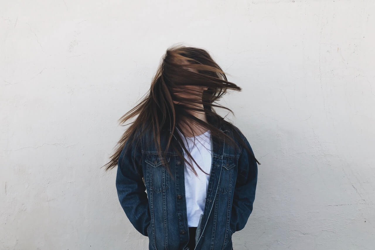 woman with hair covering her face