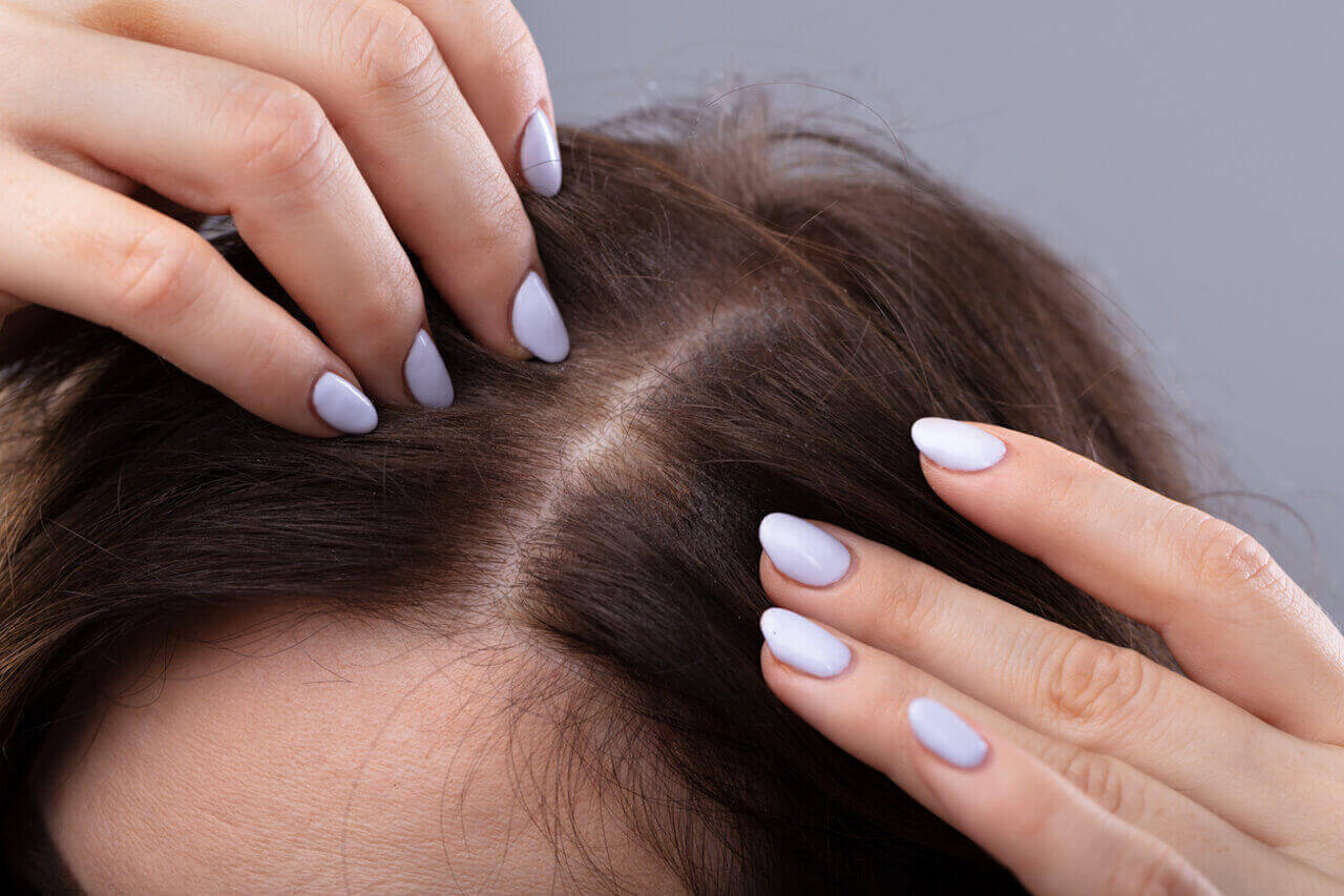 Woman touching her hair