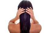 woman holding her hair back