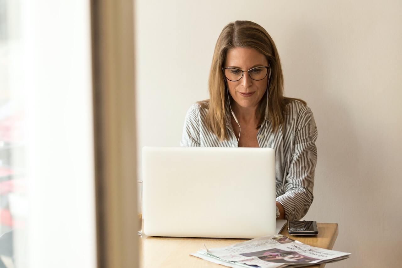 Woman typing at computer