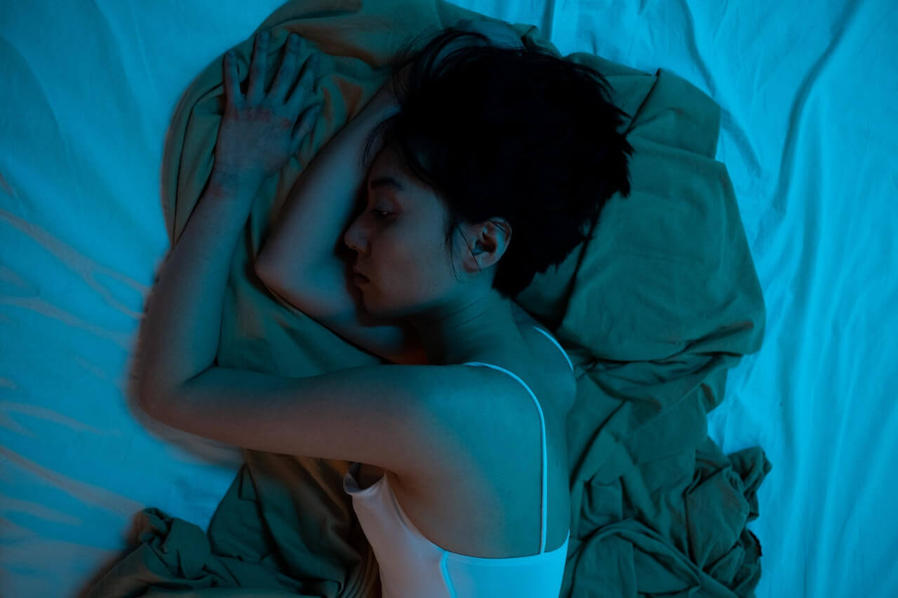 Woman laying in bed