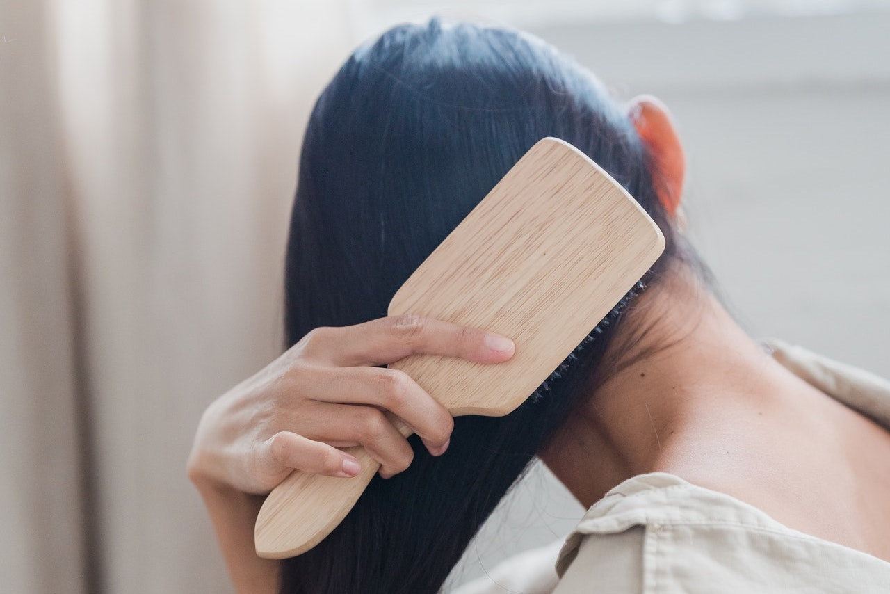 woman brushing hair