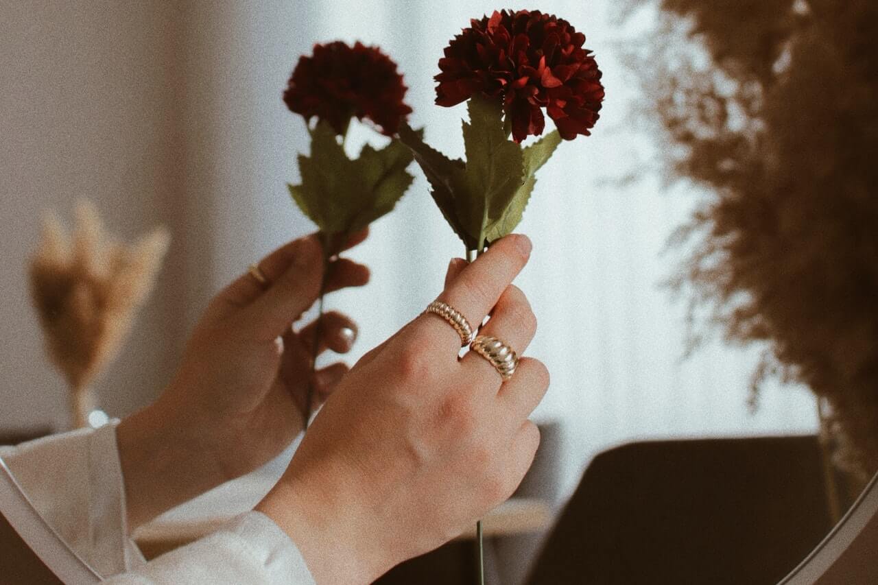 Hand holding a flower