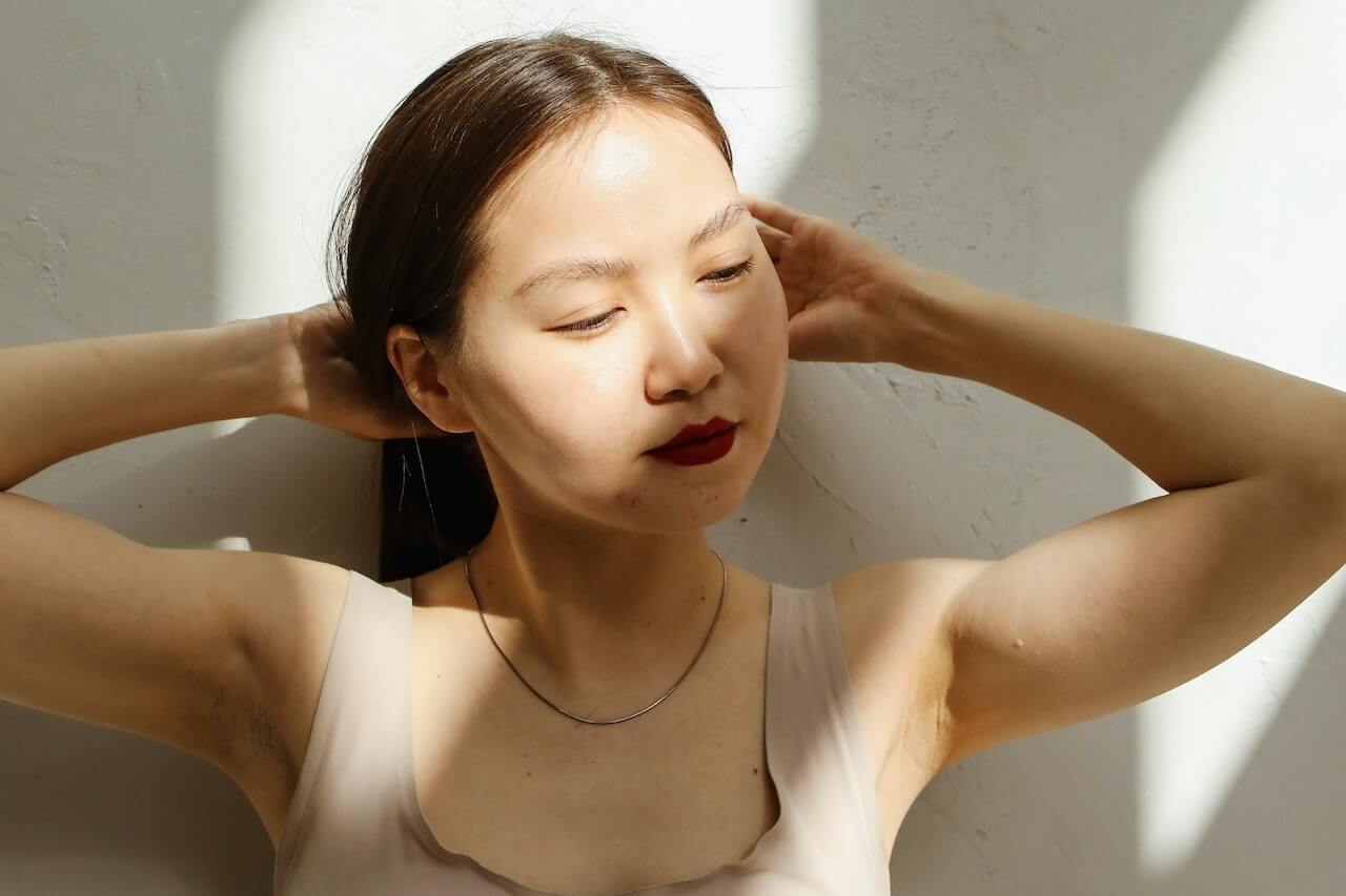 Woman touching her hair