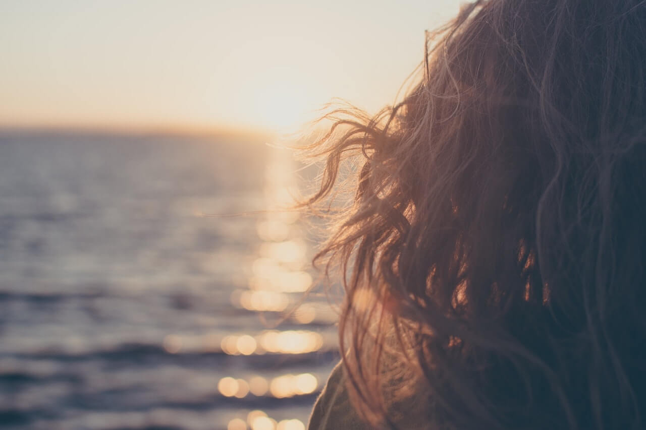 Woman looking at the ocean