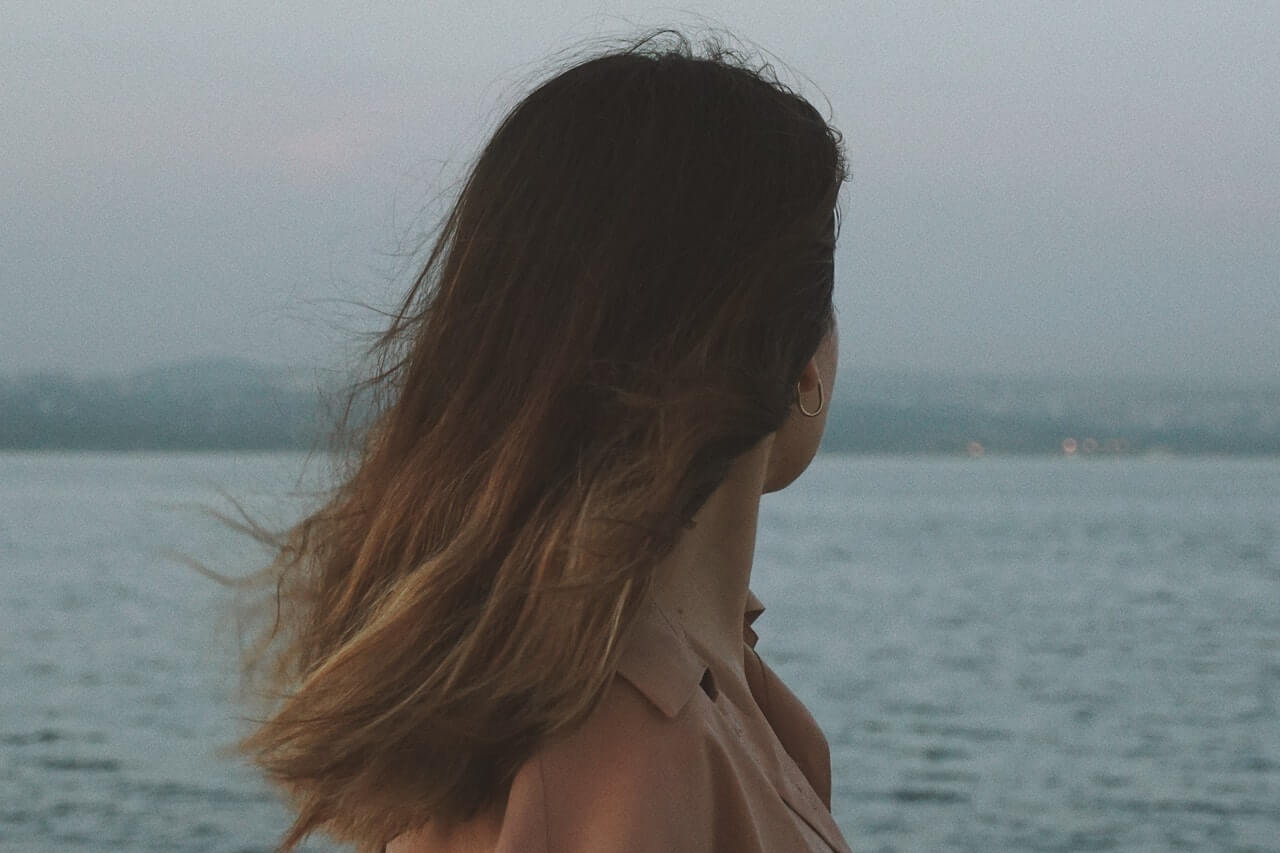 Woman looking at the ocean