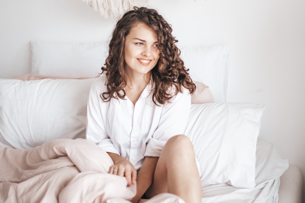 Woman sitting in bed